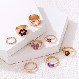 Arihant Women Set of 8 Gold Plated Purple Butterfly-Floral Finger Ring