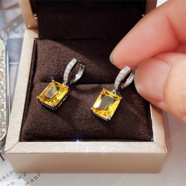 Arihant Silver Plated Yellow Rectangular AD Studded Crushed Ice Cut Drop Earrings