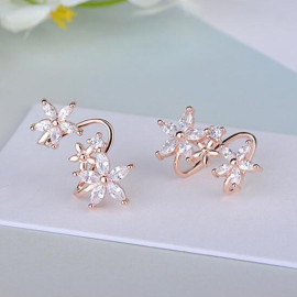 Arihant Rose Gold Plated American Diamond Studded Triple Star Shaped Earrings