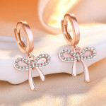 Arihant Rose Gold Plated American Diamond Studded Bow-Tie Shape Korean Stud Earrings