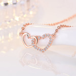 Arihant Rose Gold Plated American Diamond Studded Dual Heart Contemporary Korean Pendant