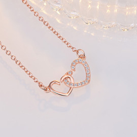 Arihant Rose Gold Plated American Diamond Studded Dual Heart Contemporary Korean Pendant